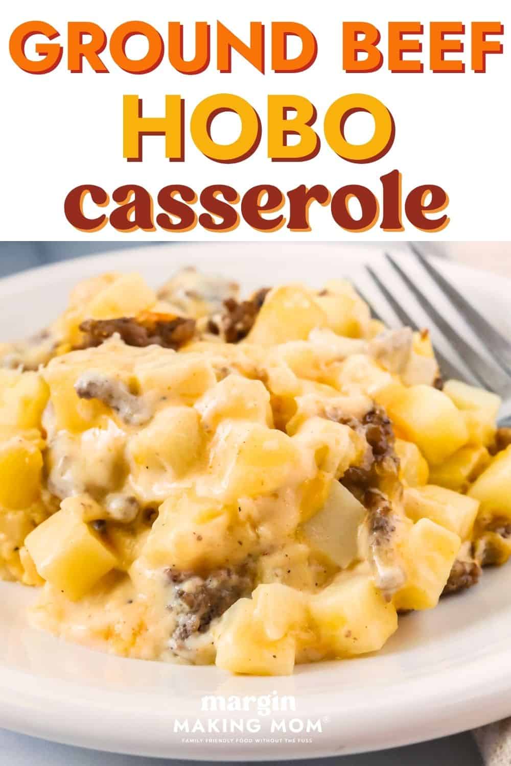 Close-up view of easy hobo casserole served on a plate, showcasing the cheesy sauce, cubed potatoes, and chunks of ground beef.