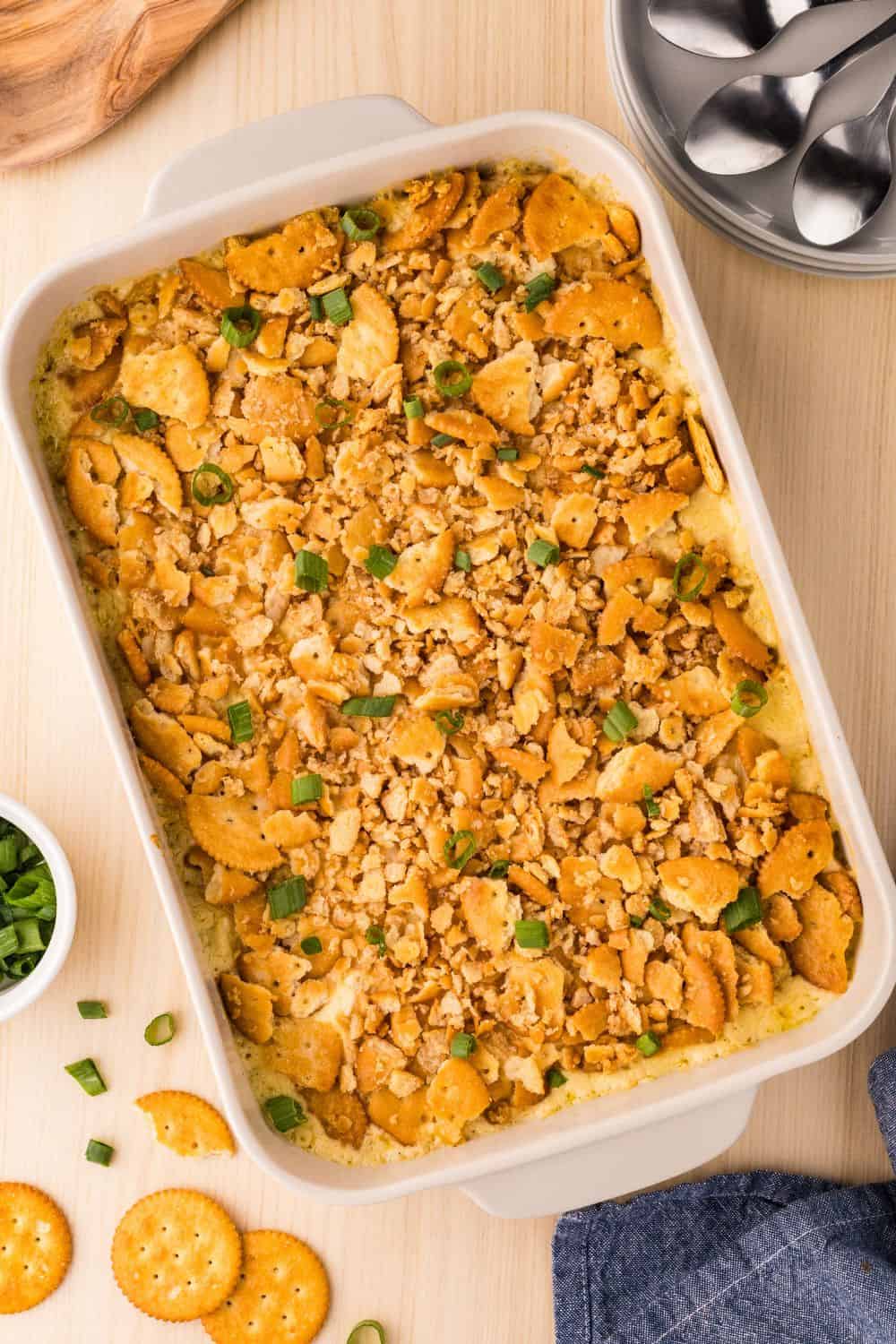 Overhead view of a white baking dish filled with southern Ritz chicken casserole.