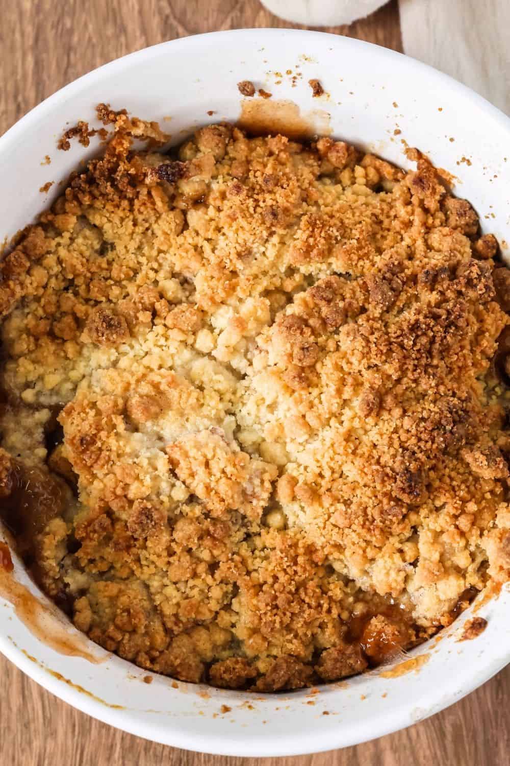 overhead view of a white baking dish filled with freshly baked apple crumble made with Bisquick.