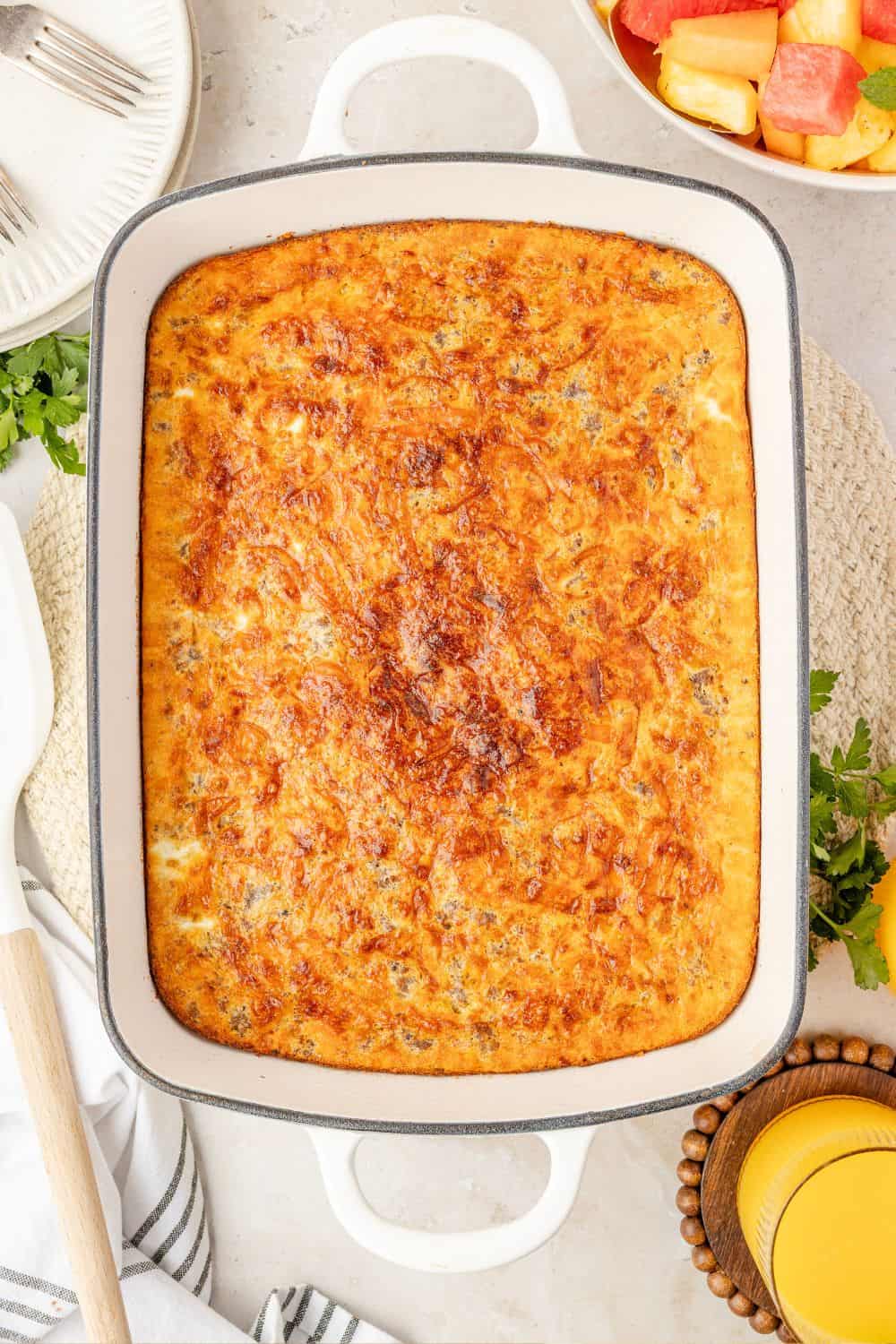overhead view of a 9x13" baking dish of freshly baked Bisquick casserole with sausage.