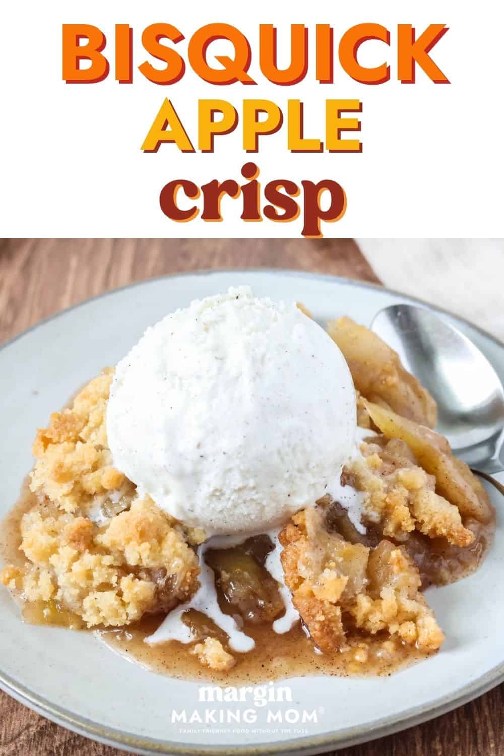Bisquick apple crisp served with ice cream on an ivory plate.