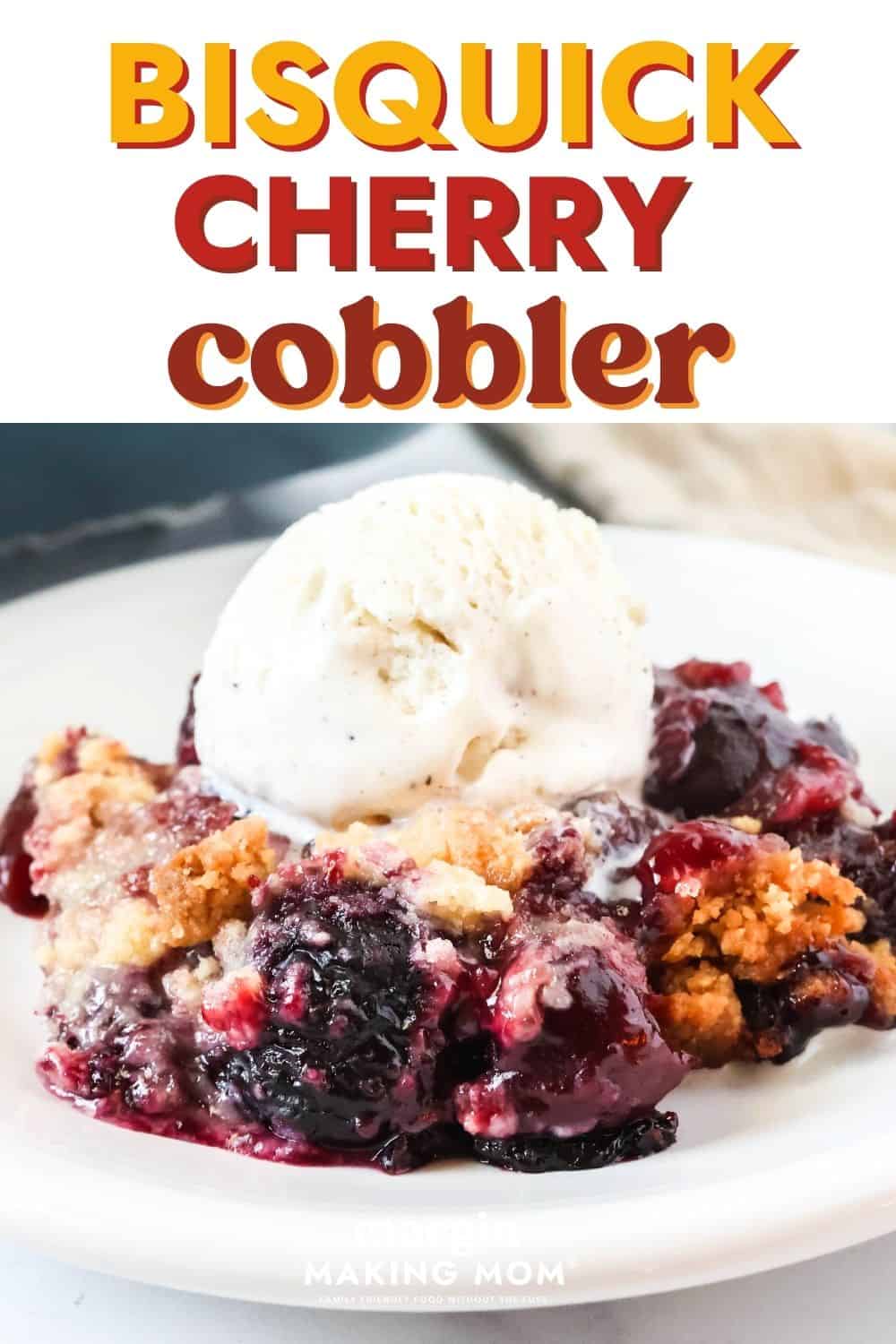 Easy Bisquick cherry cobbler served on a white dessert plate. The cobbler is topped with vanilla ice cream.