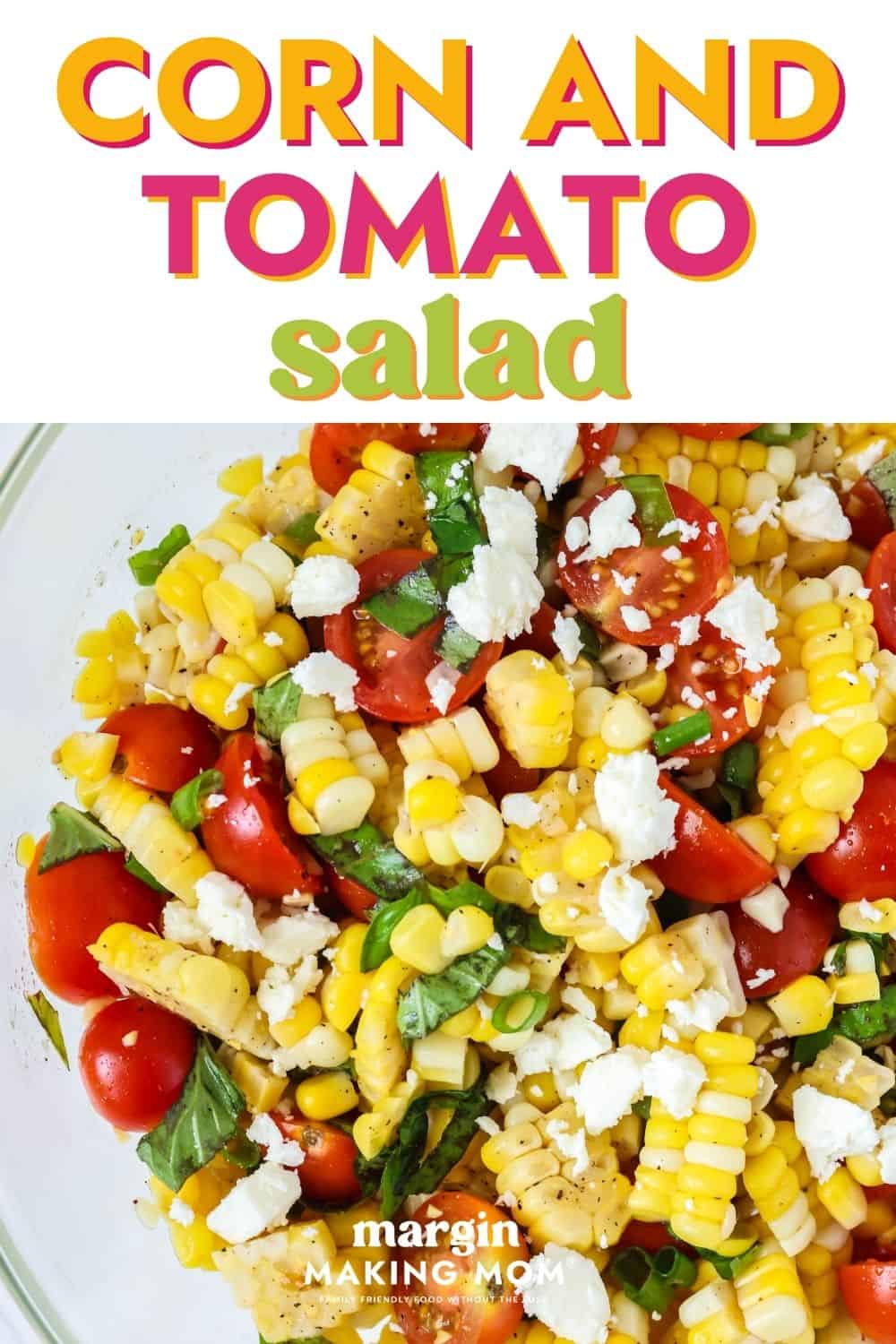 Sweet corn and tomato salad in a glass bowl.