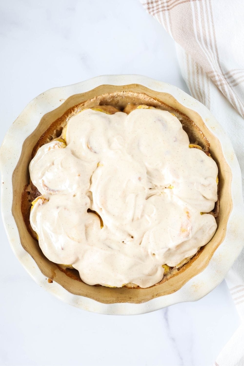 Overhead view of a round pan of the easiest pumpkin cinnamon rolls made with self-rising flour.