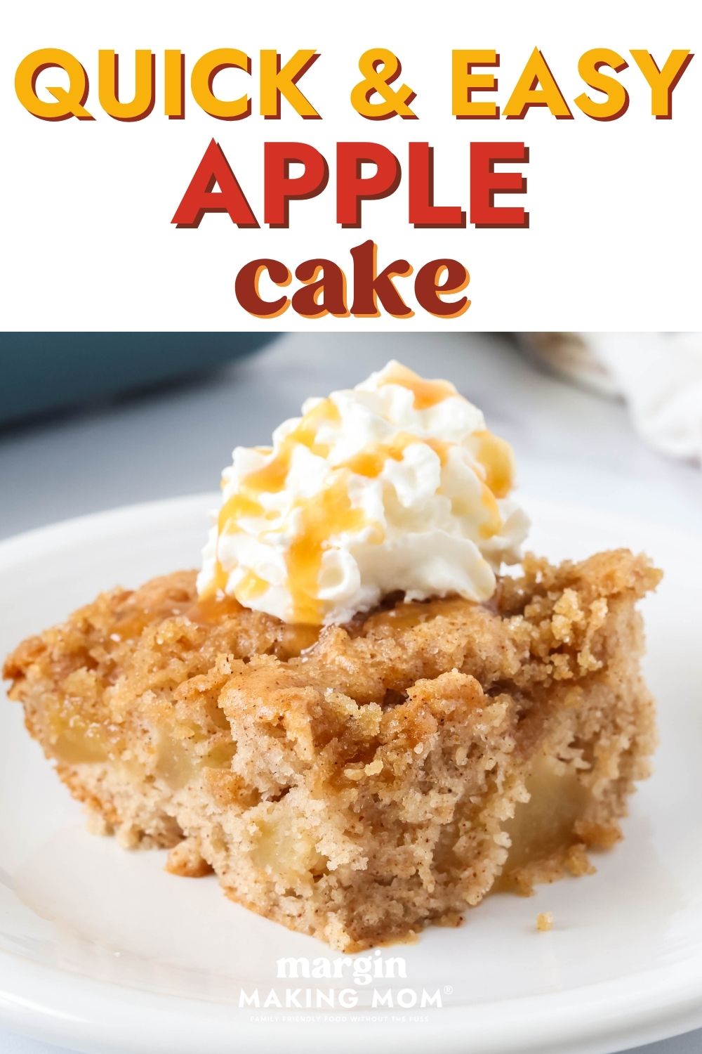 Slice of easy apple cake made with cake mix and pie filling, served on a white plate with whipped cream and caramel sauce.