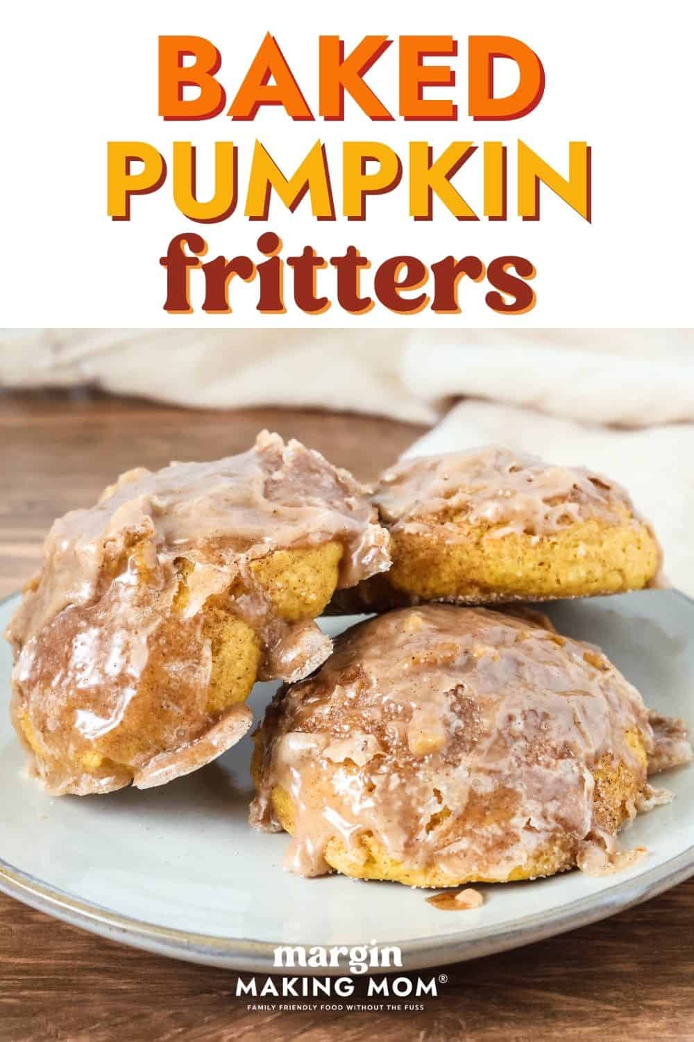 Baked pumpkin fritters made with Bisquick are topped with glaze and served on an ivory plate.