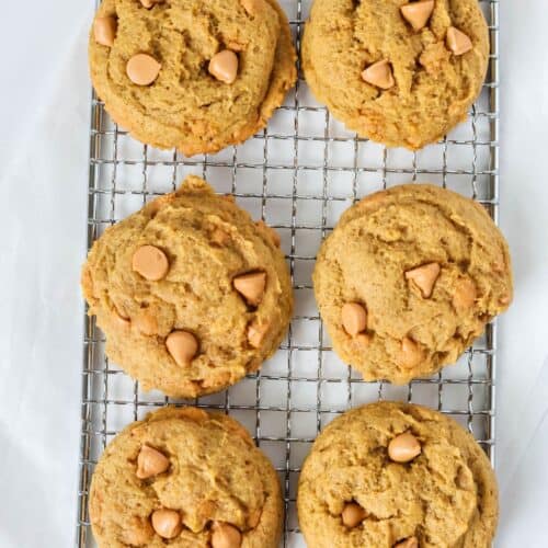 Pumpkin butterscotch cookies on a small wire cooling rack.