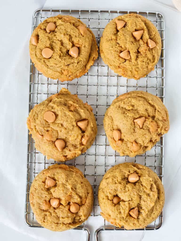 Pumpkin butterscotch cookies on a small wire cooling rack.