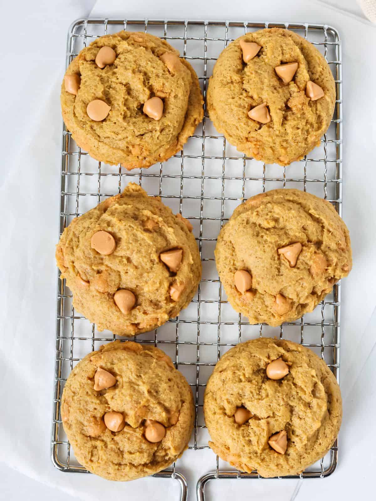 Pumpkin butterscotch cookies on a small wire cooling rack.