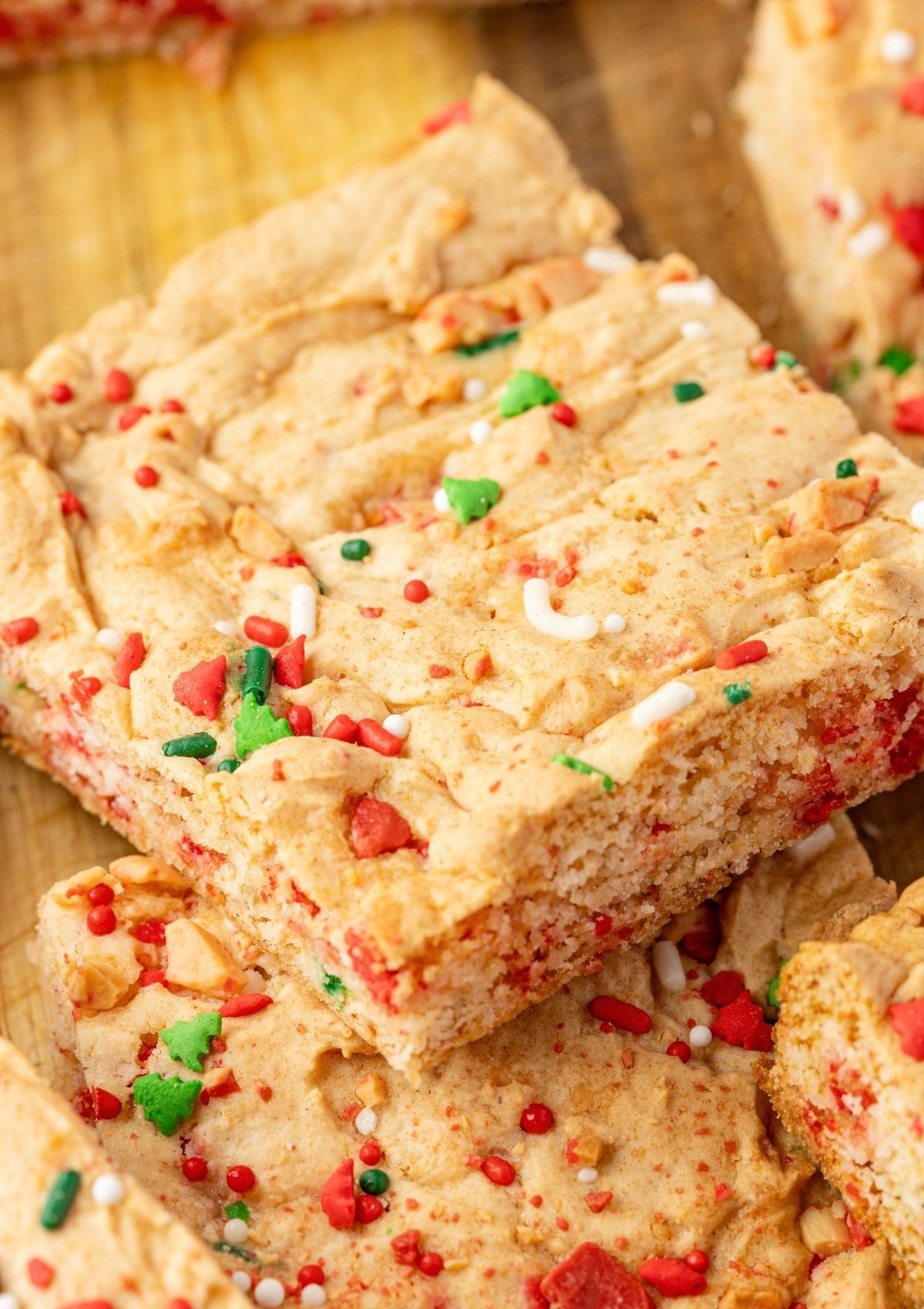 Close-up view of cake mix Christmas dessert bars made with colorful Christmas sprinkles.