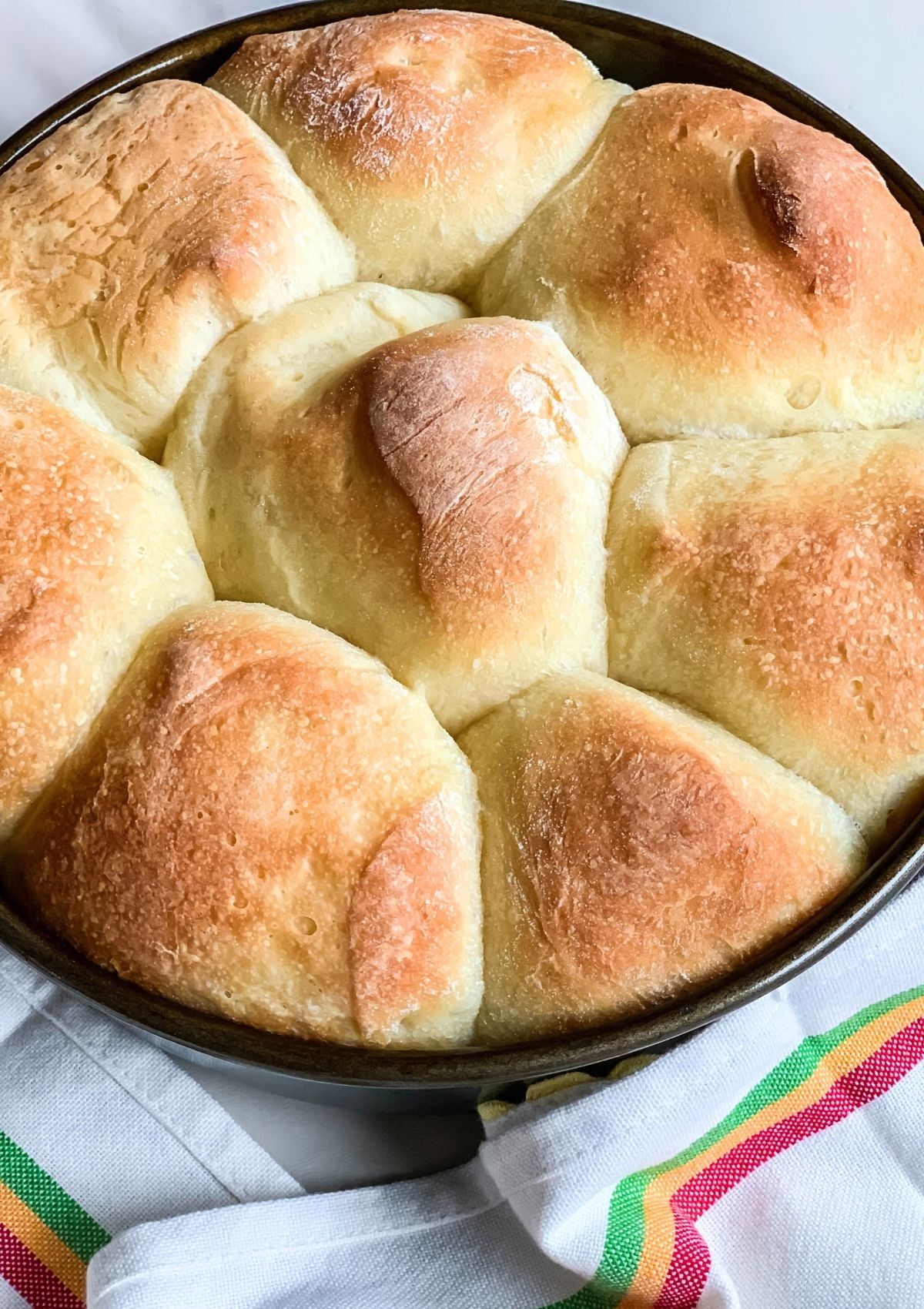 Pan of dinner rolls made from frozen dough that thawed, rose, and was baked.