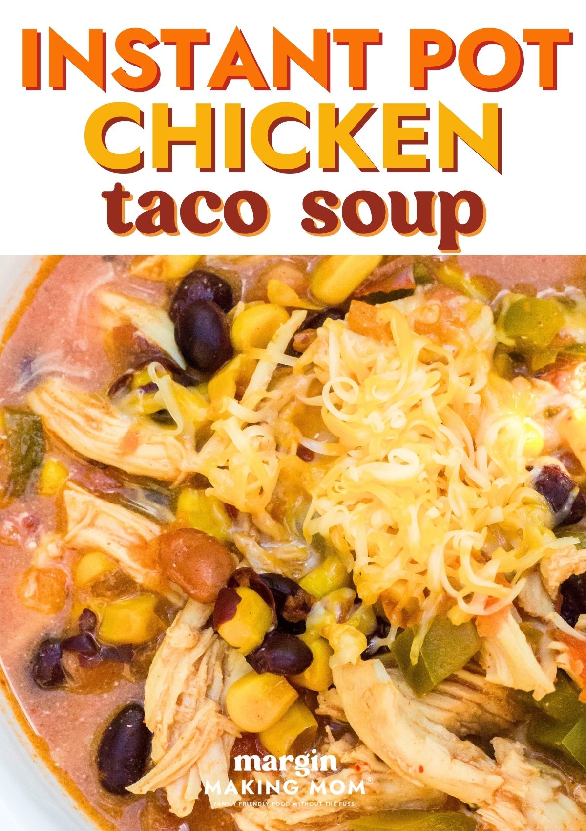 Close-up view of Instant Pot chicken taco soup garnished with shredded cheese.