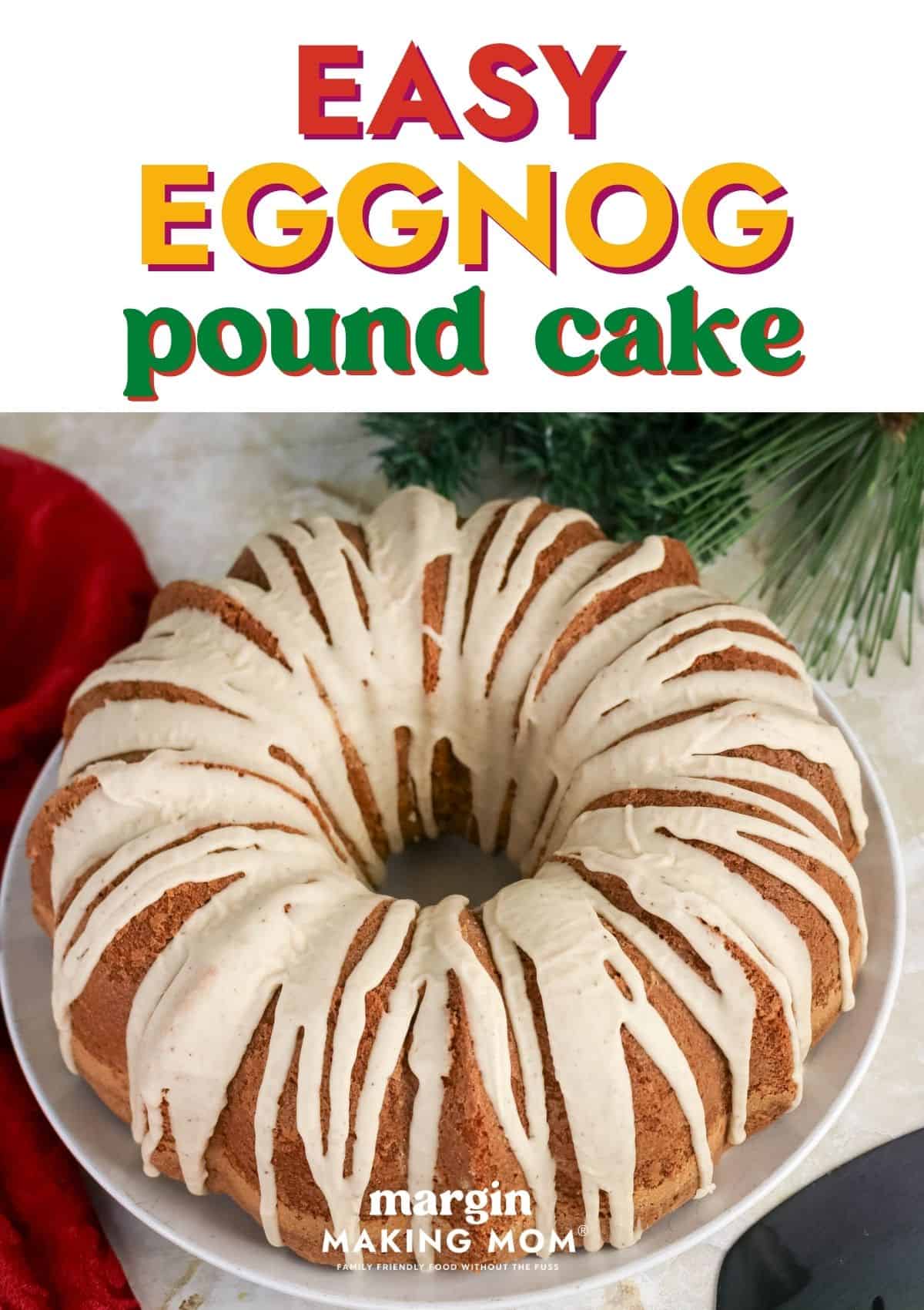 Eggnog pound cake, topped with eggnog glaze, is served on a white platter.