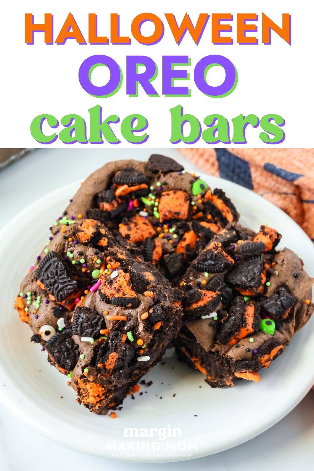 Three easy Halloween Oreo cake bars served on a white plate.