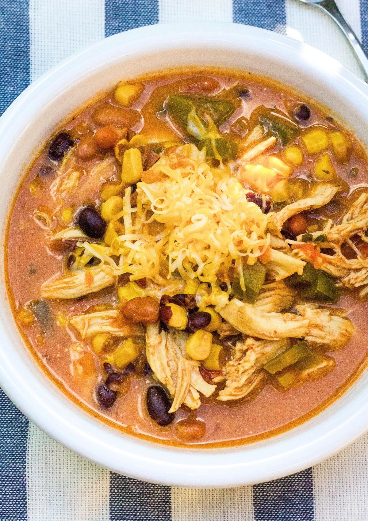 Overhead view of a white bowl filled with taco soup made with ranch seasoning and taco seasoning.