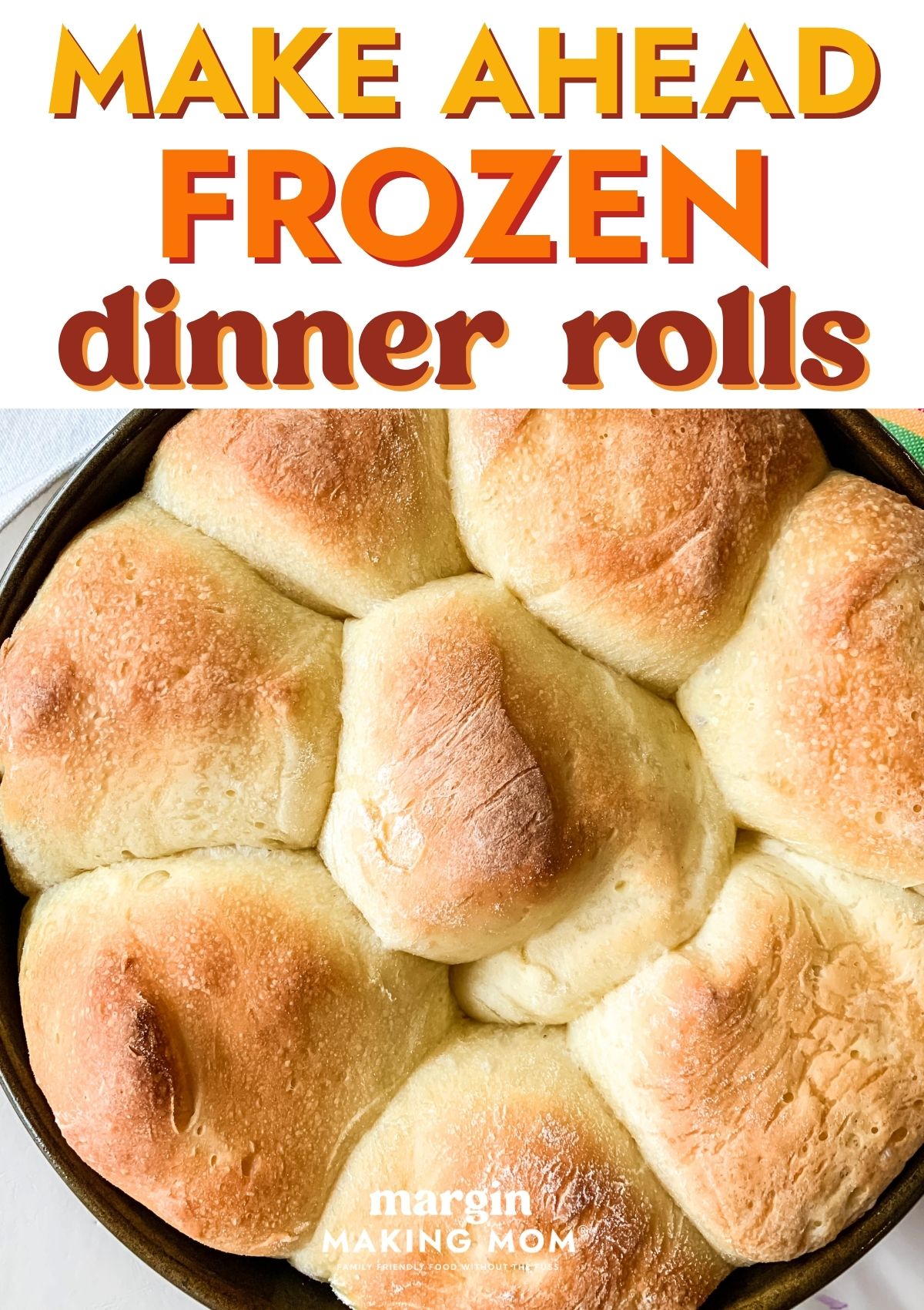 Overhead view of a pan of frozen dinner rolls that were thawed and baked.