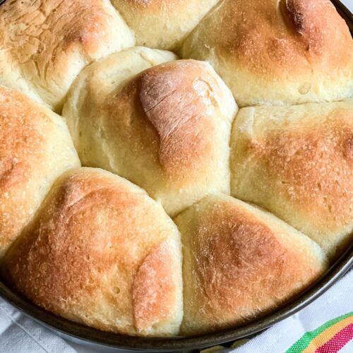 Homemade frozen dinner rolls that were baked in a pan.