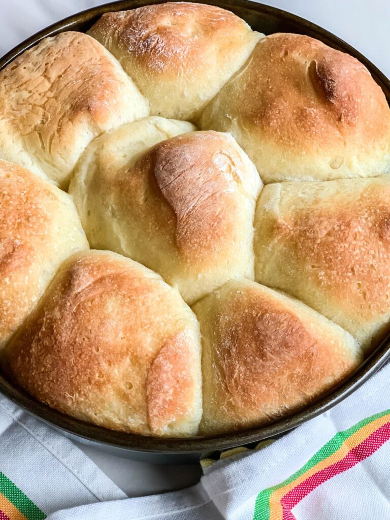 Homemade frozen dinner rolls that were baked in a pan.