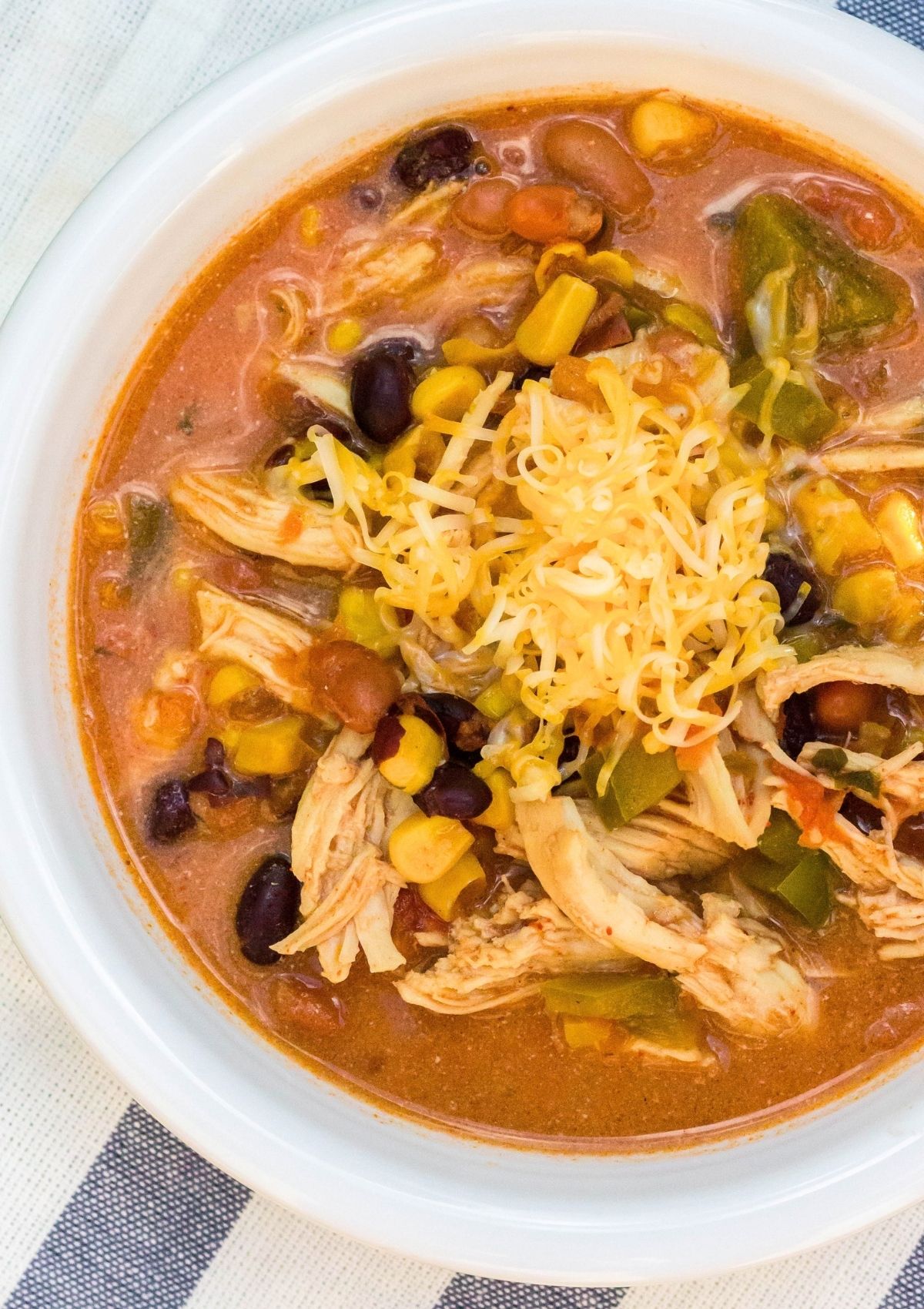 Instant Pot 7 can chicken taco soup served in a white bowl.