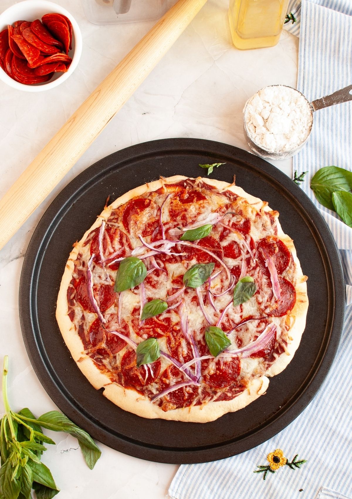Overhead view of a pizza on a pizza pan.